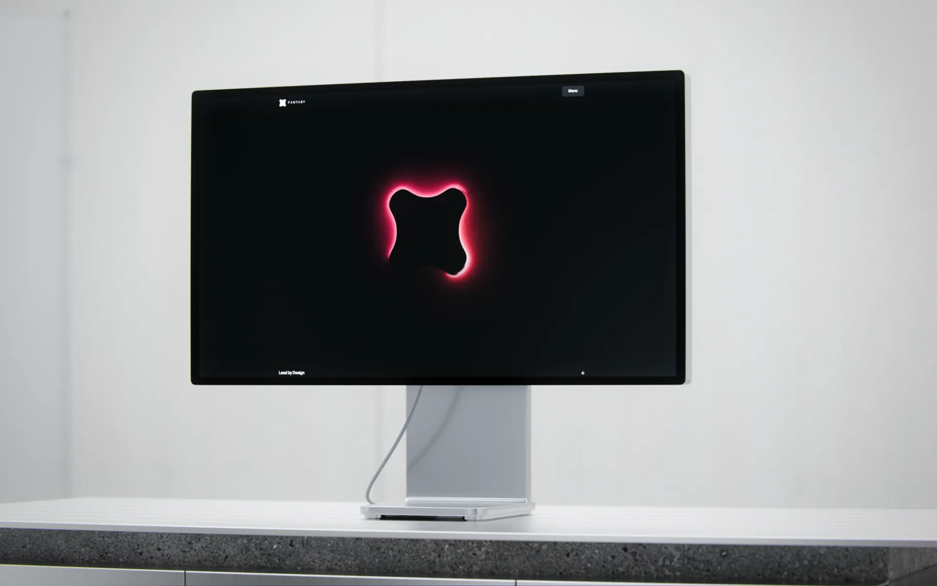 Custom desktop display mockup showing the Fantasy mark in a light studio setting