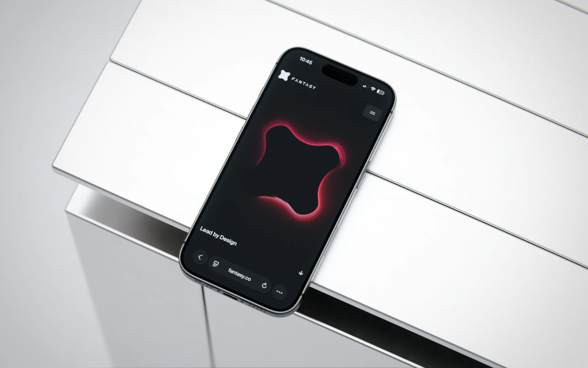 Custom phone mockup displaying the Fantasy mark on a reflective metal surface