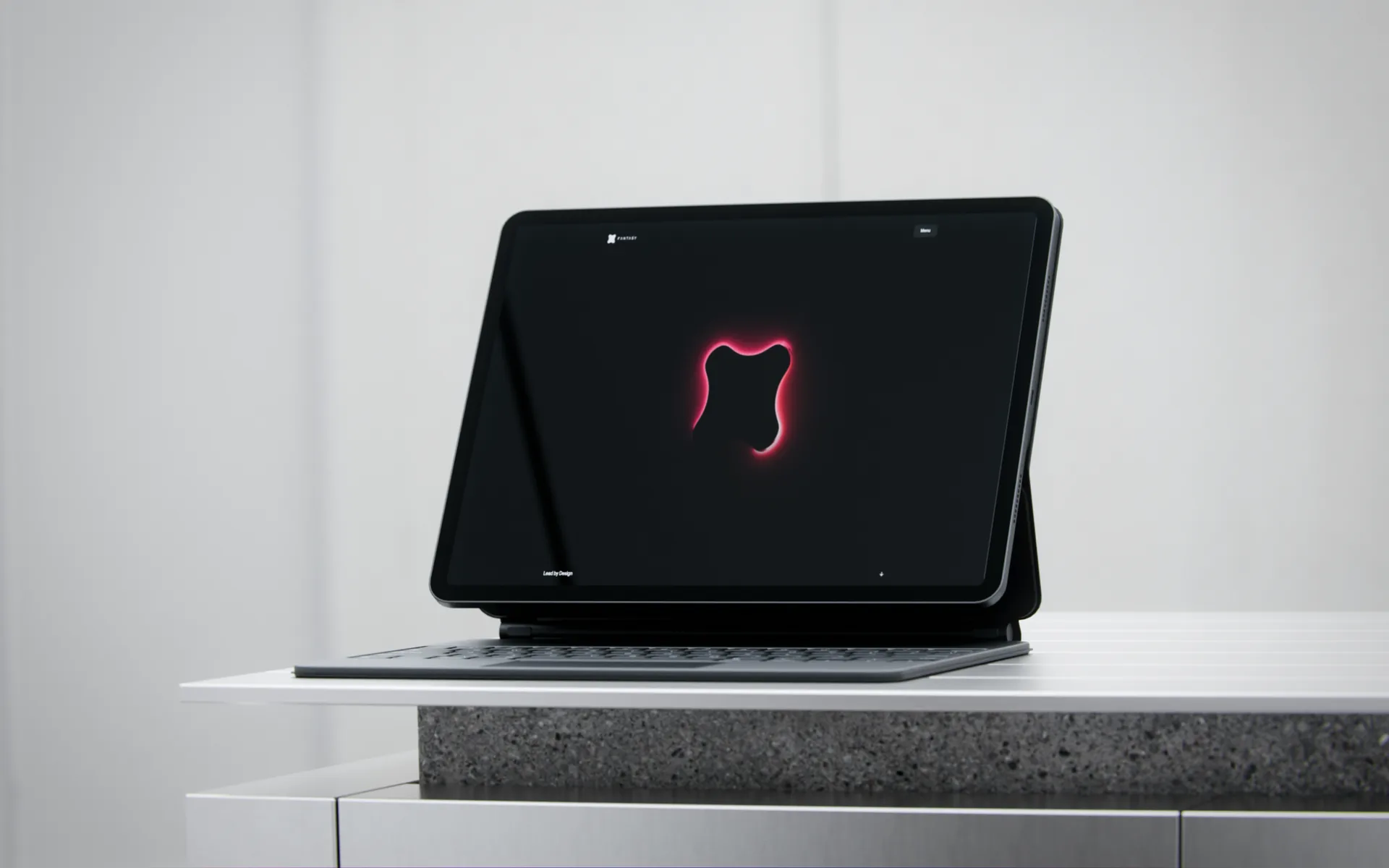 Custom tablet mockup with the Fantasy mark on a dark screen above a stone plinth