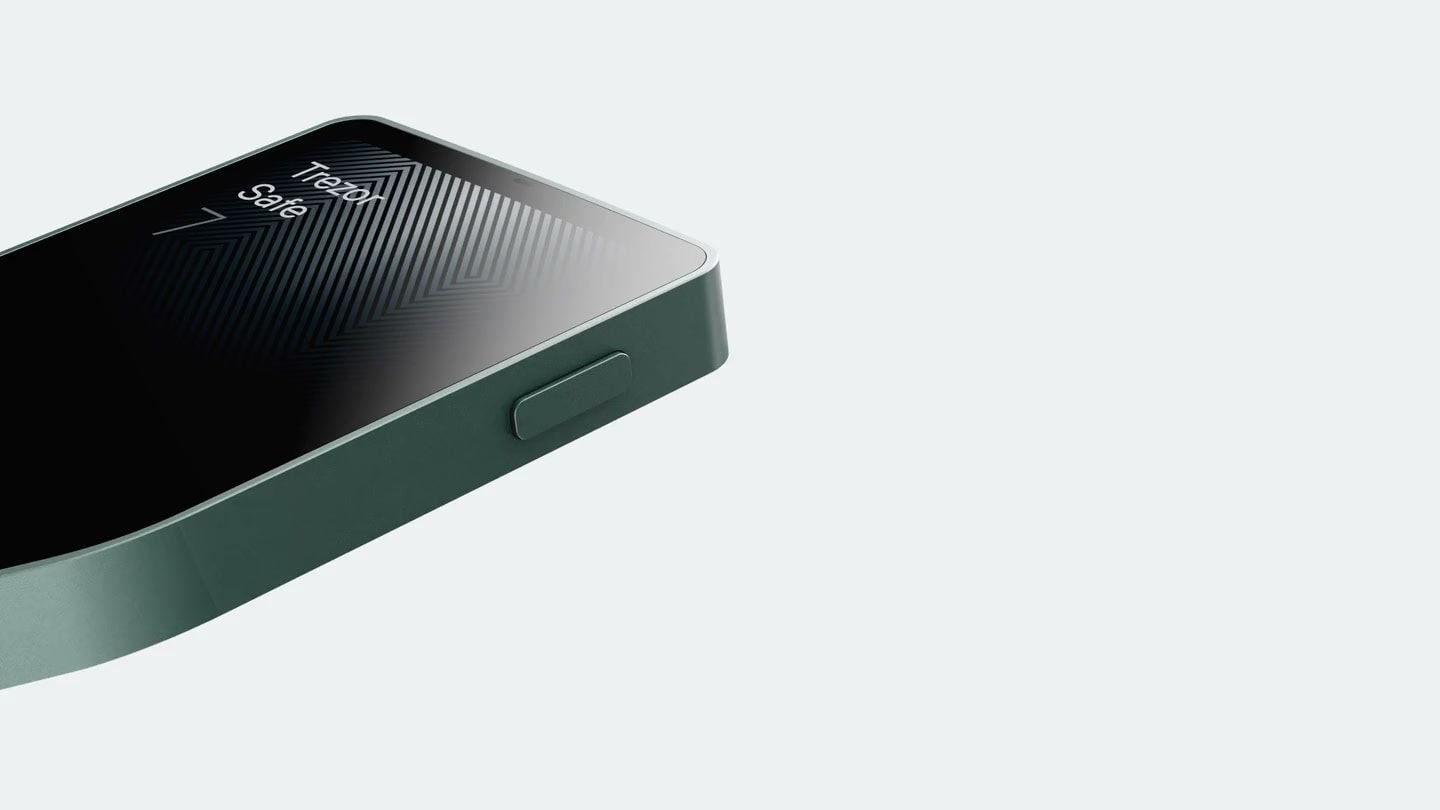 Green Trezor hardware wallet rotating against a light background