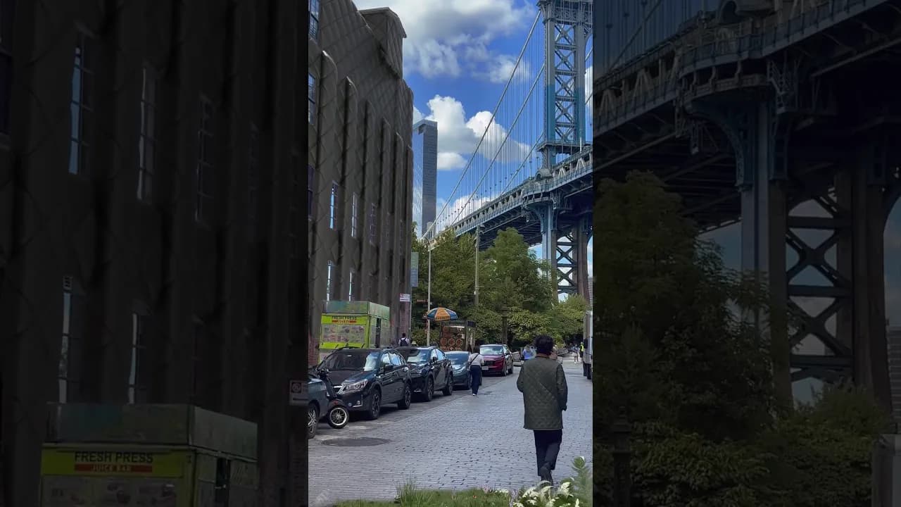 Quilted fabric covering buildings beside a city bridge