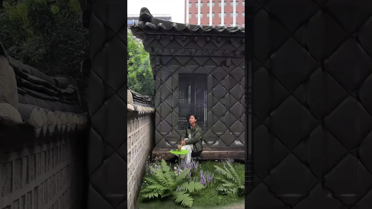 Quilted fabric and ferns surrounding a courtyard entrance