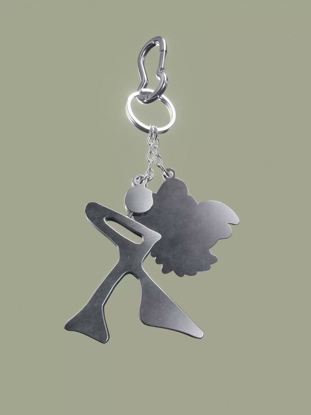 Polished metal Rounds logo keychain rotating against a muted green background