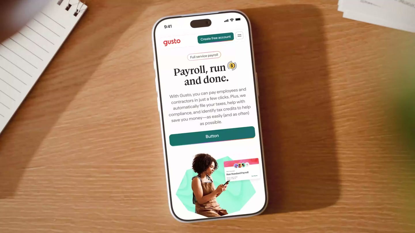 Gusto phone close-up and desktop display in a warm studio scene